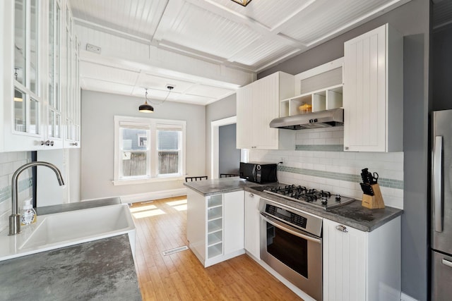 2943 Taylor St NE, Minneapolis, MN 55418 - kitchen with open shelves, white cabinets, backsplash, and stainless steel appliances