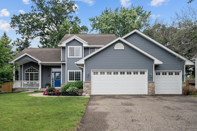 4032 Hollyhock Cir N, Brooklyn Park, MN 55443 - traditional-style home with brick siding, driveway, an attached garage, a front lawn, and roof with shingles
