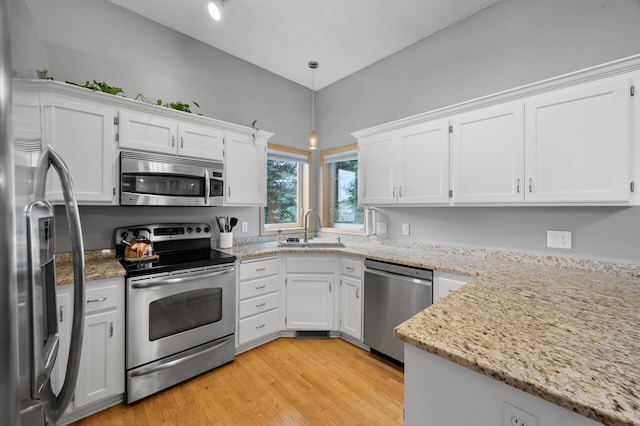 4032 Hollyhock Cir N, Brooklyn Park, MN 55443 - kitchen featuring stainless steel appliances, white cabinets, and light stone counters