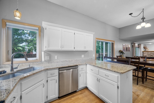 4032 Hollyhock Cir N, Brooklyn Park, MN 55443 - kitchen with dishwasher, a peninsula, white cabinets, light wood-type flooring, and healthy amount of natural light