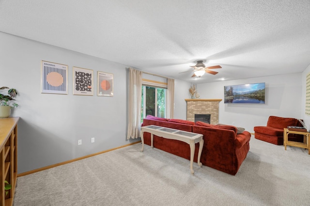 4032 Hollyhock Cir N, Brooklyn Park, MN 55443 - carpeted living area featuring a ceiling fan, a brick fireplace, and a textured ceiling