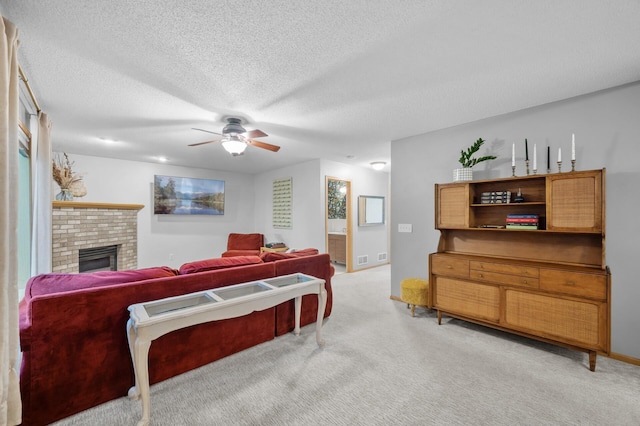4032 Hollyhock Cir N, Brooklyn Park, MN 55443 - living room with light carpet, ceiling fan, a fireplace, and a textured ceiling