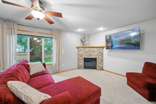 4032 Hollyhock Cir N, Brooklyn Park, MN 55443 - carpeted living area with ceiling fan, a fireplace, a textured ceiling, and recessed lighting
