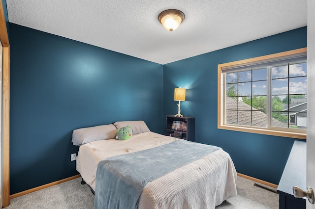 4032 Hollyhock Cir N, Brooklyn Park, MN 55443 - bedroom featuring carpet floors and a textured ceiling