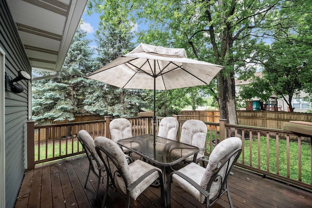 4032 Hollyhock Cir N, Brooklyn Park, MN 55443 - wooden deck featuring outdoor dining area and a fenced backyard