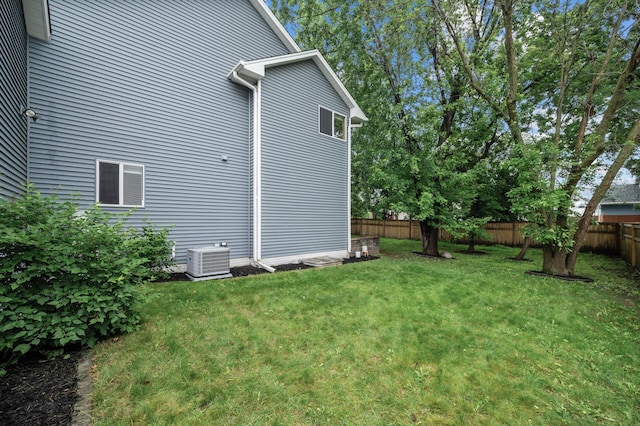 4032 Hollyhock Cir N, Brooklyn Park, MN 55443 - view of home's exterior with a fenced backyard and a central air condition unit