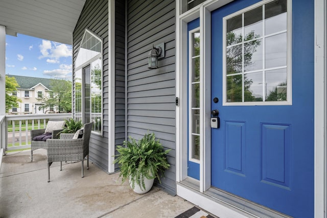 4032 Hollyhock Cir N, Brooklyn Park, MN 55443 - view of exterior entry with a porch