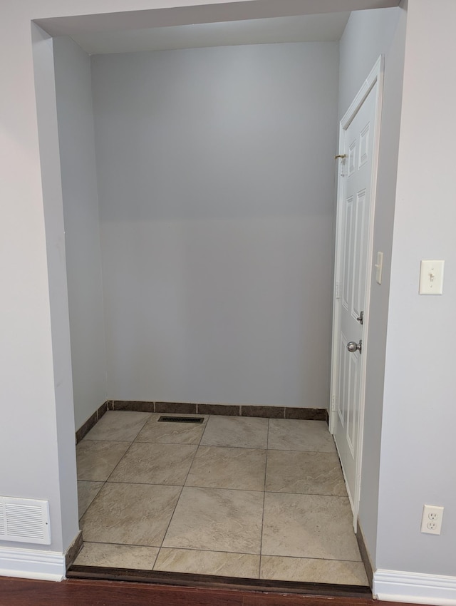 interior space with visible vents and baseboards
