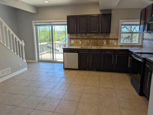 kitchen with electric range, visible vents, tasteful backsplash, stainless steel dishwasher, and a sink