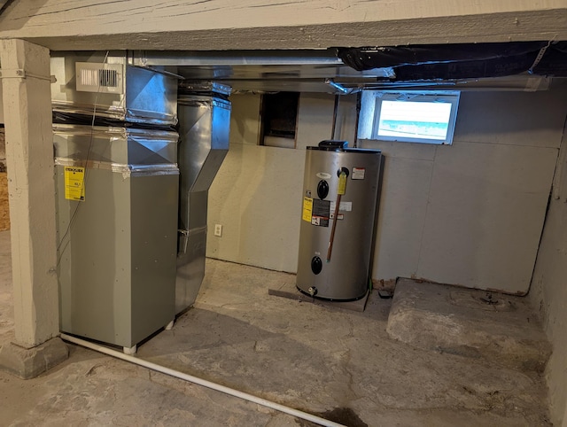 utilities featuring visible vents, heating unit, and water heater