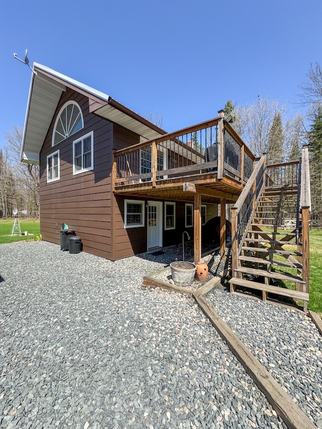 17783 Lookout Tower Rd NE, Hines, MN 56647 - back of house featuring a wooden deck and stairs