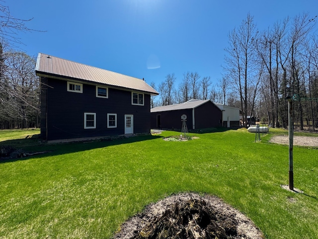 17783 Lookout Tower Rd NE, Hines, MN 56647 - rear view of property featuring a yard and metal roof