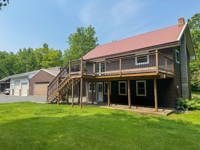 17783 Lookout Tower Rd NE, Hines, MN 56647 - rear view of house with a yard, a wooden deck, and a garage