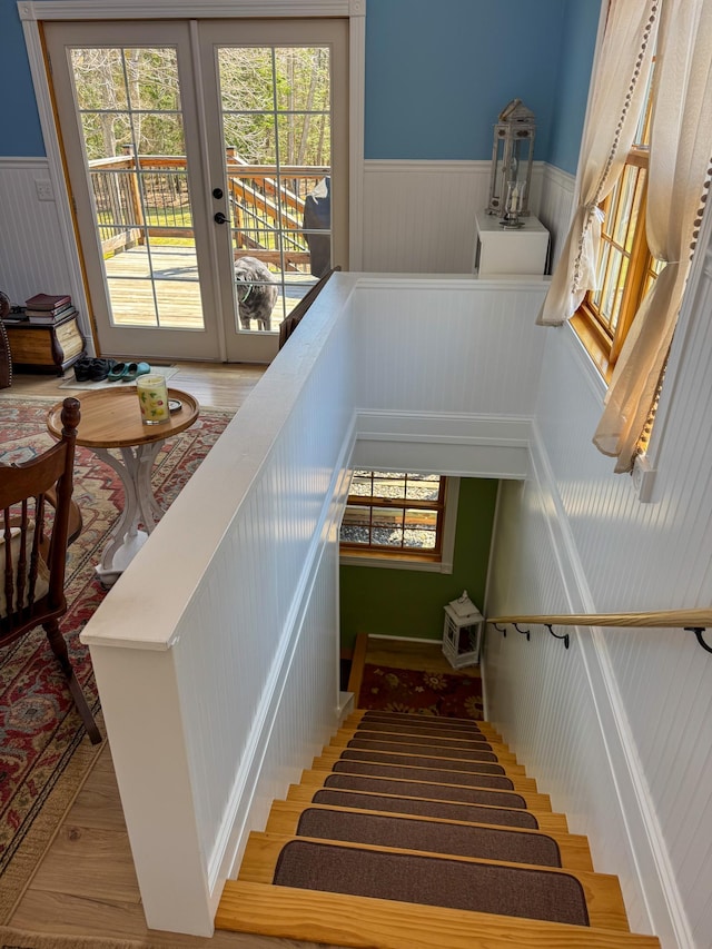 17783 Lookout Tower Rd NE, Hines, MN 56647 - staircase with wainscoting, french doors, and wood finished floors
