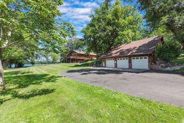 1122 Andrew Dr NE, Lake Andrew Twp, MN 56273 - view of grassy yard featuring a detached garage
