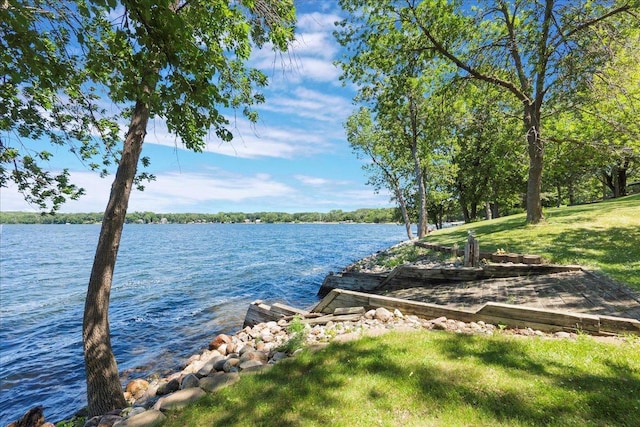 1122 Andrew Dr NE, Lake Andrew Twp, MN 56273 - dock with a water view and a yard