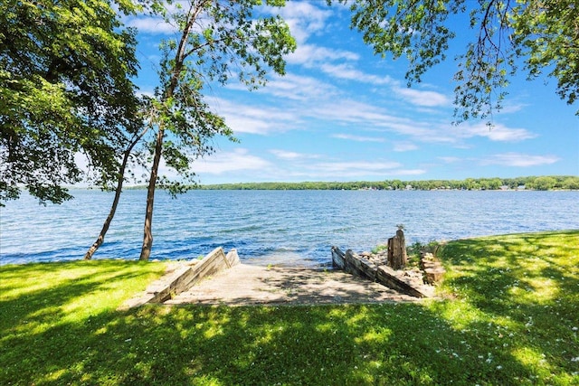 1122 Andrew Dr NE, Lake Andrew Twp, MN 56273 - dock featuring a water view and a yard