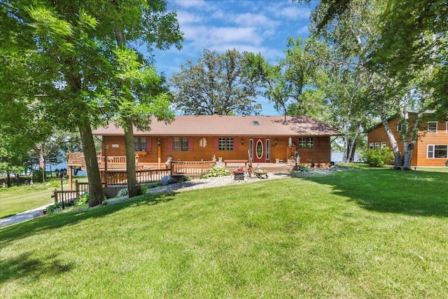 1122 Andrew Dr NE, Lake Andrew Twp, MN 56273 - back of property with a lawn and a deck
