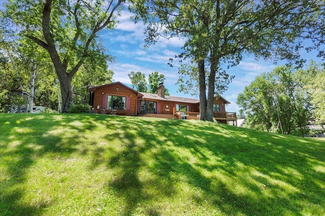 1122 Andrew Dr NE, Lake Andrew Twp, MN 56273 - view of green lawn with a deck