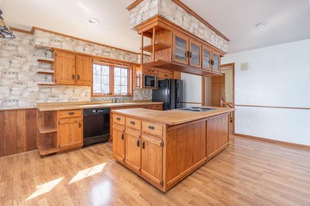1122 Andrew Dr NE, Lake Andrew Twp, MN 56273 - kitchen featuring black appliances, open shelves, a sink, light wood finished floors, and crown molding