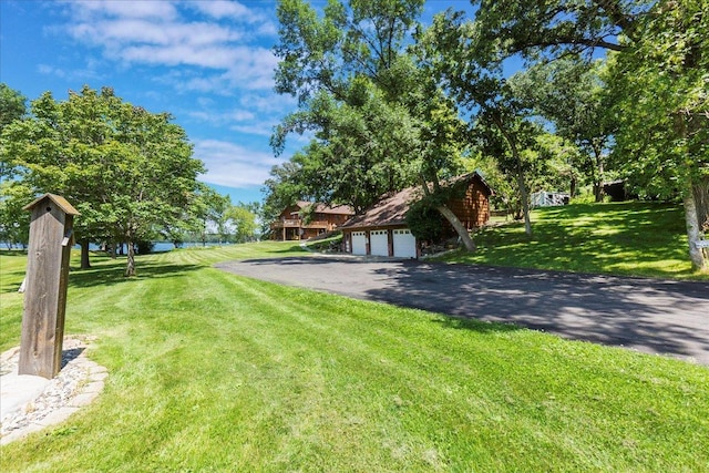 1122 Andrew Dr NE, Lake Andrew Twp, MN 56273 - view of grassy yard with a detached garage