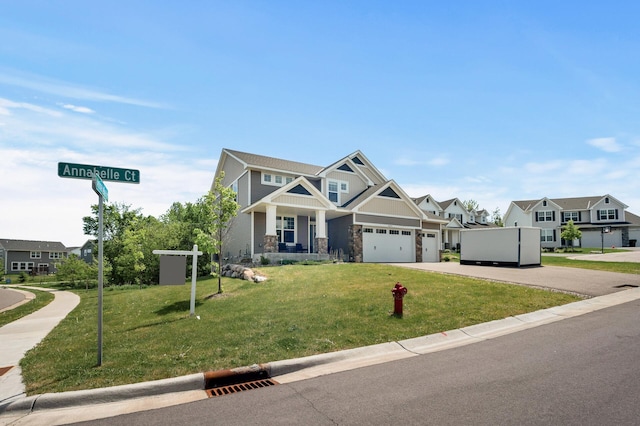 6674 Annabelle Ct, Corcoran, MN 55340 - craftsman-style house featuring concrete driveway, a garage, a front yard, and a residential view