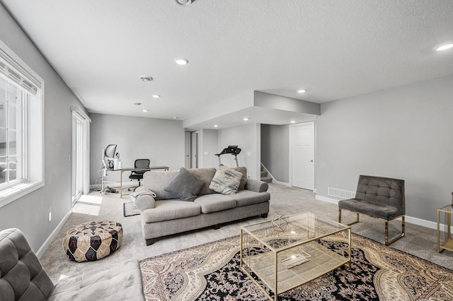 6674 Annabelle Ct, Corcoran, MN 55340 - living room featuring light colored carpet, stairs, recessed lighting, baseboards, and a textured ceiling