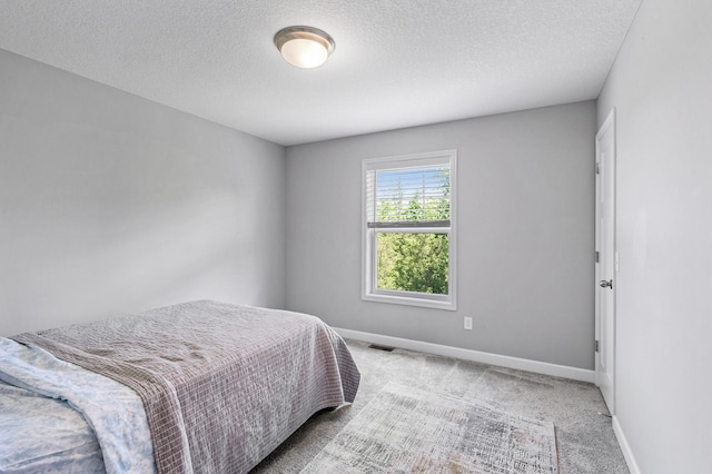 6674 Annabelle Ct, Corcoran, MN 55340 - bedroom with carpet flooring, baseboards, and a textured ceiling