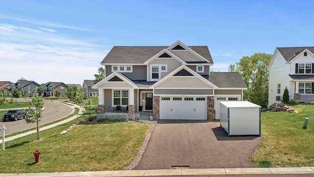 6674 Annabelle Ct, Corcoran, MN 55340 - craftsman-style house with driveway, a front lawn, stone siding, a shingled roof, and a porch