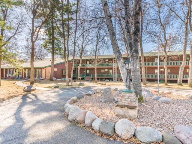 view of front of property with a wooden deck