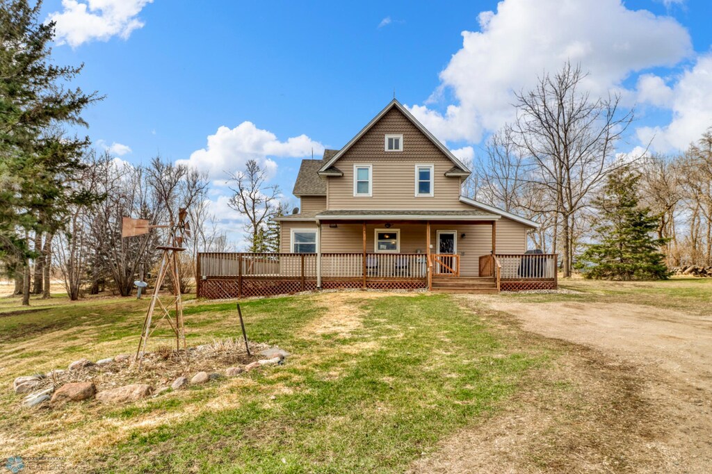 30812 County Highway 21, Oscar Twp, MN 56579 - back of house featuring a lawn, a shingled roof, and a deck