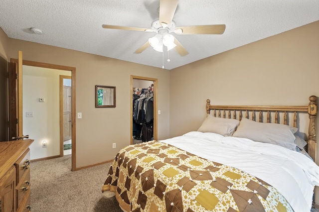 8366 Parkview Ave NE, Otsego, MN 55330 - carpeted bedroom with a spacious closet, baseboards, a textured ceiling, ceiling fan, and a closet