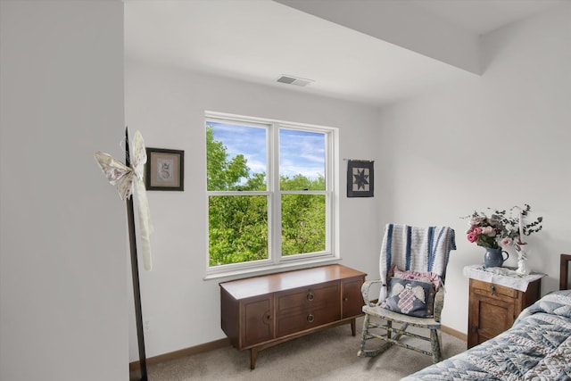 bedroom featuring light colored carpet, baseboards, and visible vents