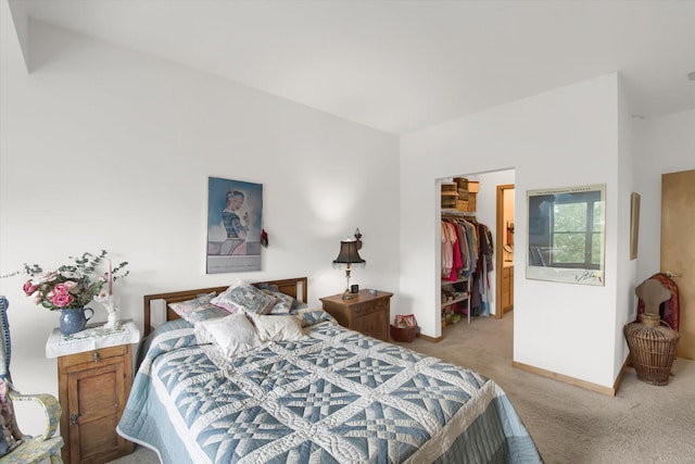 bedroom featuring a closet, carpet, and a spacious closet