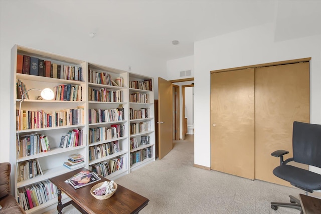 office space with visible vents and carpet flooring