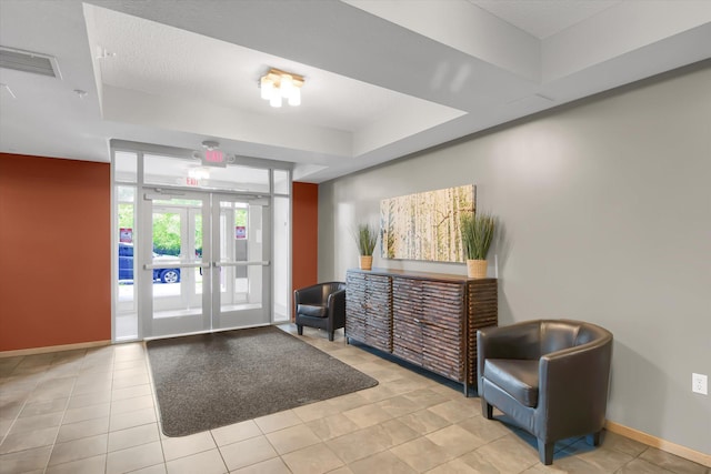 building lobby featuring visible vents