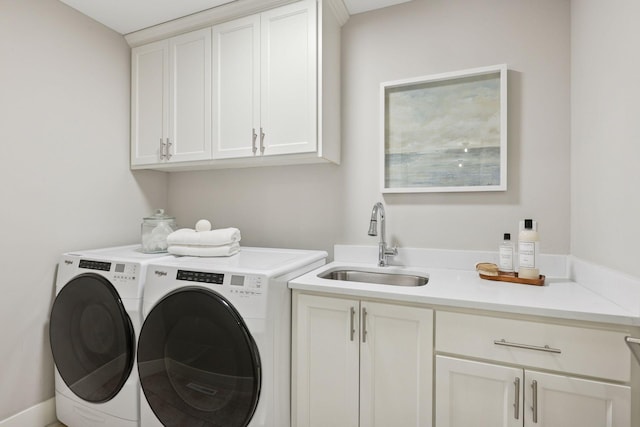 washroom featuring washer and dryer and cabinet space