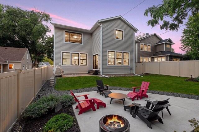 back of property featuring an outdoor fire pit, entry steps, and a patio area