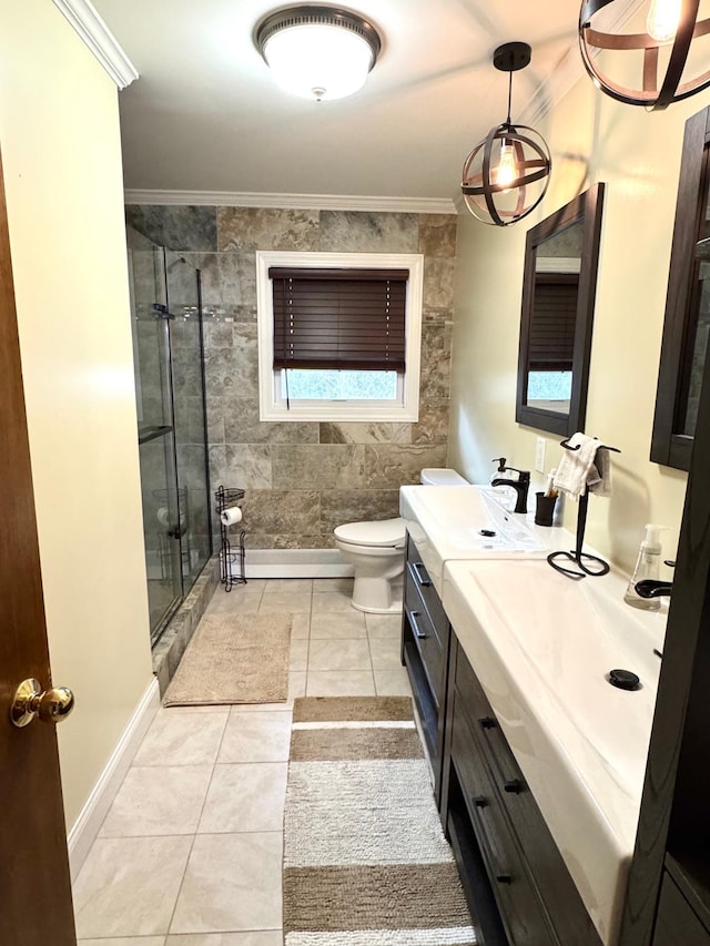 bathroom with a shower stall, crown molding, tile patterned floors, vanity, and toilet
