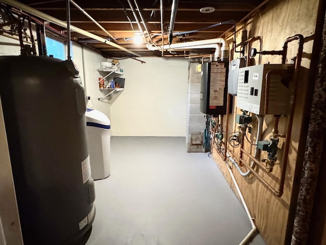 unfinished below grade area featuring water heater