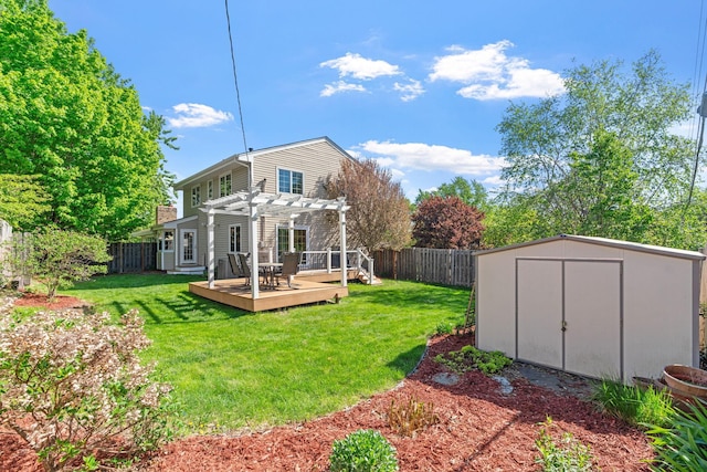 back of house with a pergola, a wooden deck, a shed, and an outdoor structure