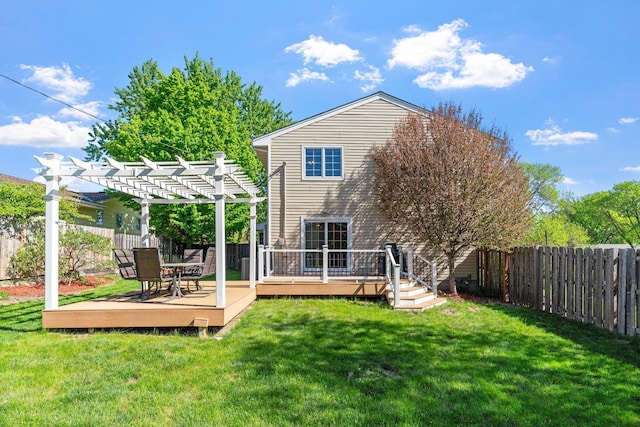 rear view of house with a pergola and a deck