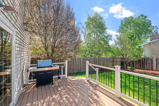 wooden terrace featuring a grill