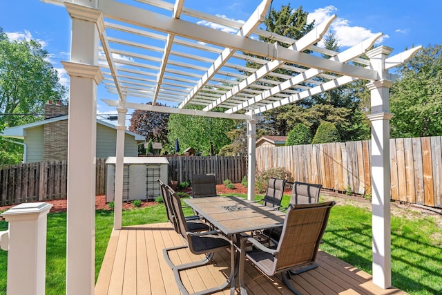 deck with outdoor dining area, a pergola, a shed, and an outdoor structure