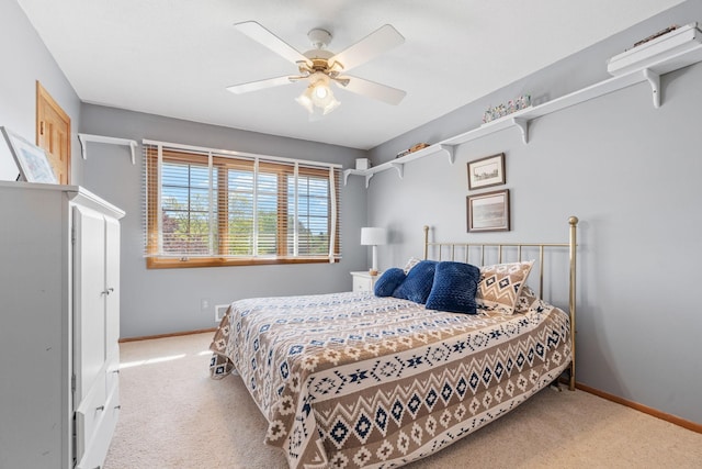 bedroom featuring carpet flooring, baseboards, and a ceiling fan
