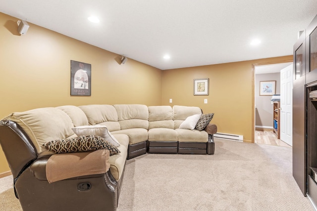 living room featuring a baseboard heating unit, recessed lighting, light colored carpet, and baseboards