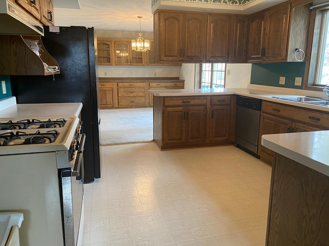 2509 6th St SW, Willmar, MN 56201 - kitchen featuring appliances with stainless steel finishes, a sink, light countertops, and a healthy amount of sunlight