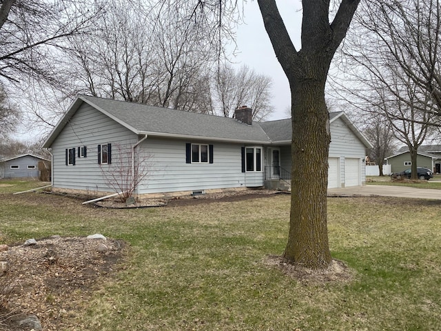 2509 6th St SW, Willmar, MN 56201 - ranch-style home with a chimney, roof with shingles, a front yard, and concrete driveway