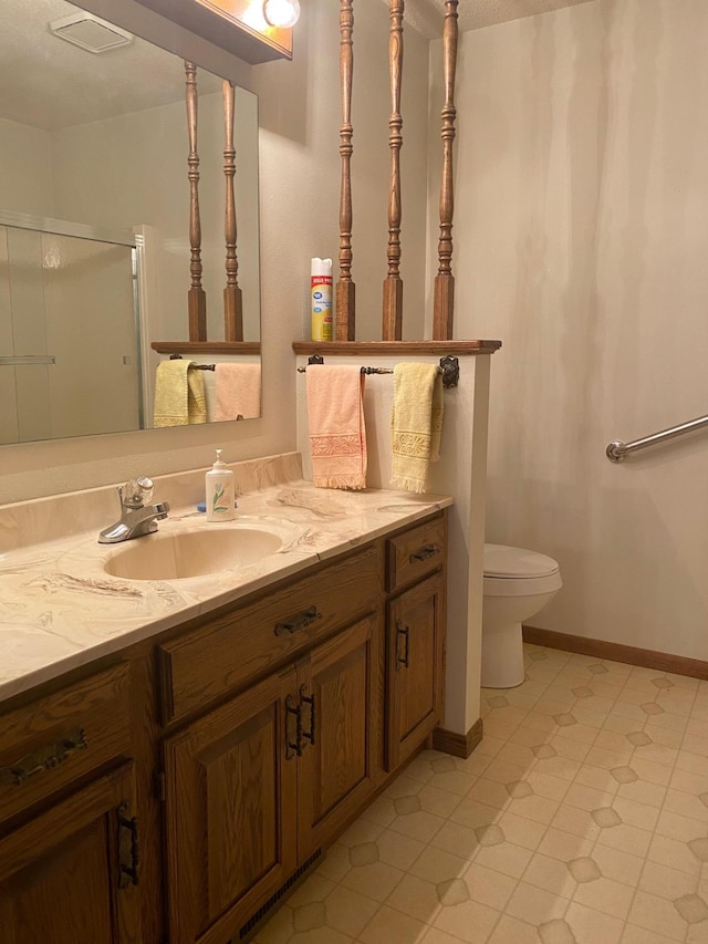 2509 6th St SW, Willmar, MN 56201 - full bathroom with a shower stall, toilet, vanity, and tile patterned floors