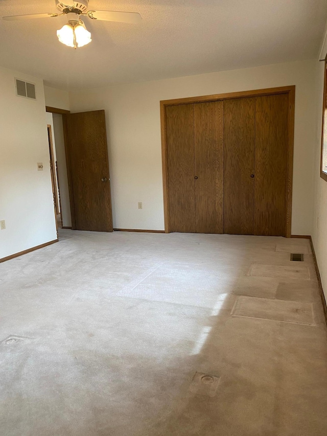 2509 6th St SW, Willmar, MN 56201 - unfurnished bedroom with visible vents, a closet, and light colored carpet
